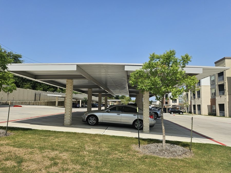 Back-to-back carport on masonry columns at an apartment community