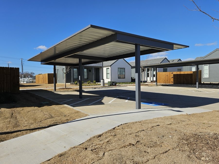 Dark bronze end-post carport over accessible parking