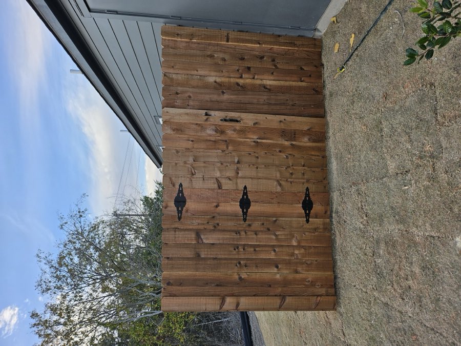 Wood privacy fence with a double gate
